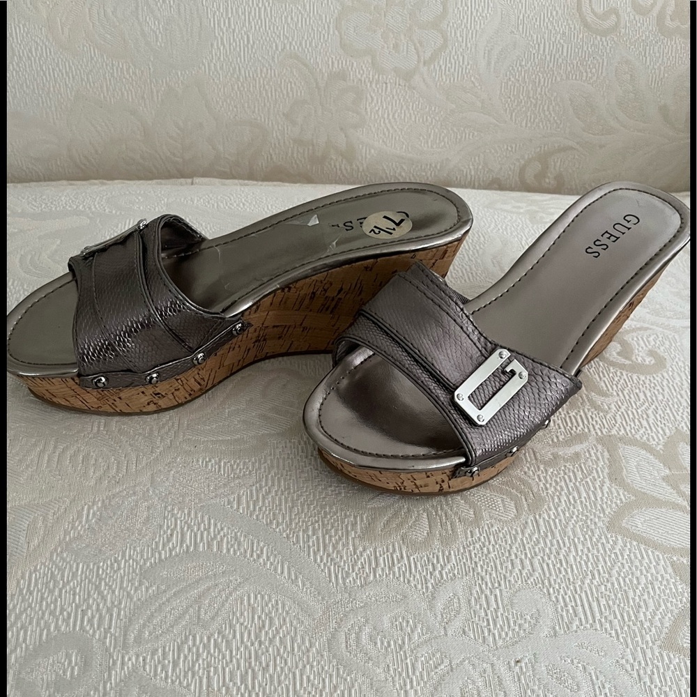 Guess Silver edgy wedge mules with silver metal grommets and buckle. NWOT